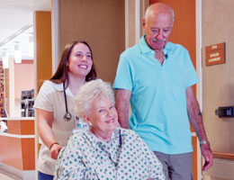 A nurse rolling a patient's wheelchair through the hospital hallways. Links to Donor-Advised Funds A nurse rolling a patient's wheelchair through the hospital hallways. Links to Donor-Advised Funds